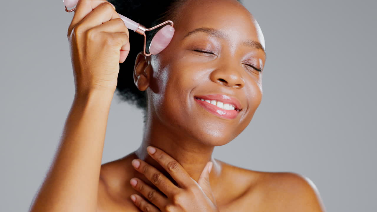 Rose quartz, black woman and face roller massage