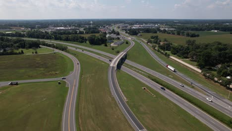 an aerial view of five long roadways on a beautiful day