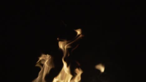 bonfire flames in a dark background. slow motion