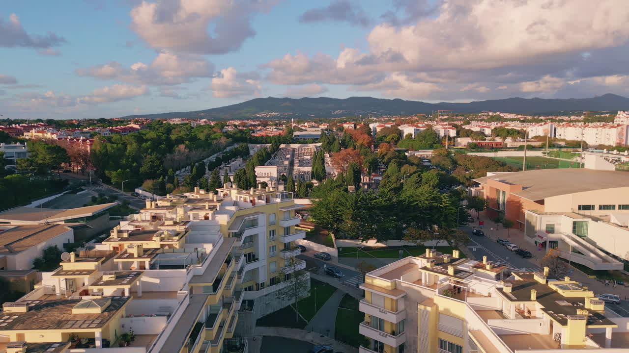 Aerial view sprawling cityscape illuminated morning sunlight. Modern buildings