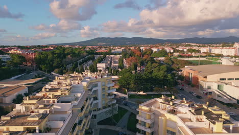 aerial view sprawling cityscape illuminated morning sunlight. modern buildings