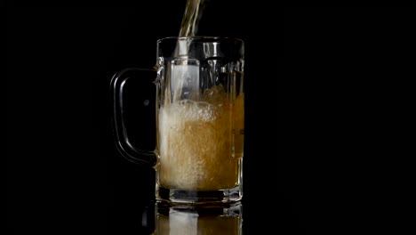 pouring beer in a mug, but some drops are going wrong