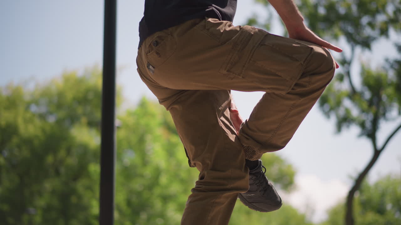 Man Stretches Leg, Relaxing Foot Stretch On Sunny Day, Man Performing Leg Stretch Outdoors For Flexibility, Individual Practicing Calf And Leg Flexibility Exercises In Bright Park Environment