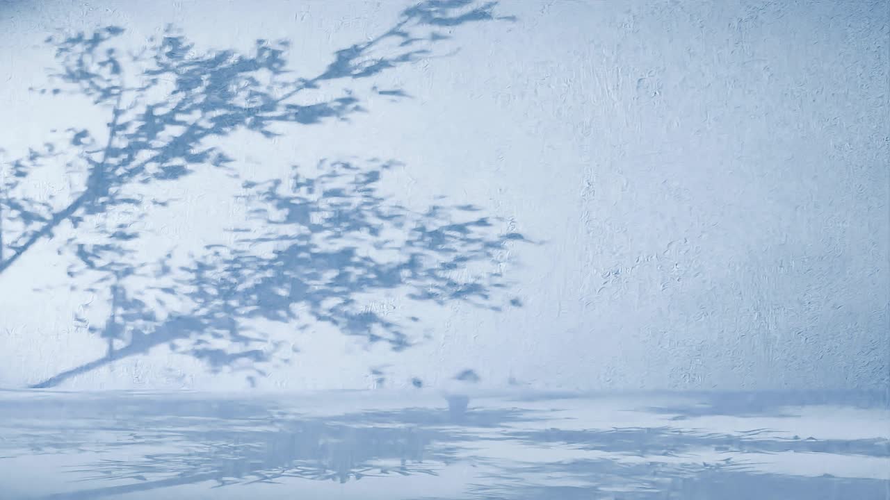 a Tree branches shadow on textured blue wall. Nature silhouette concept