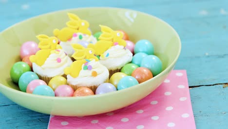 Colorful-chocolate-Easter-eggs-with-cup-cakes-in-bowl