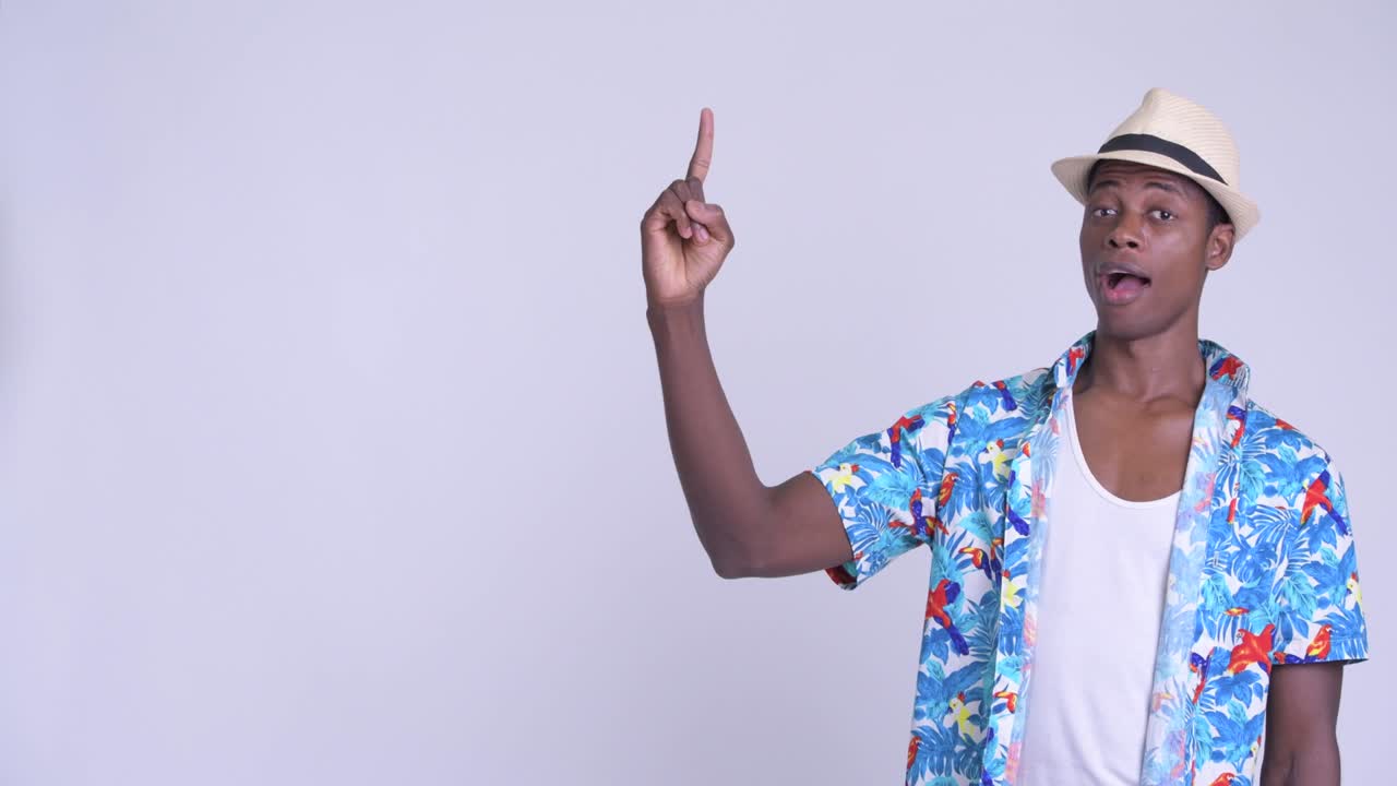 Young handsome African tourist man ready for vacation