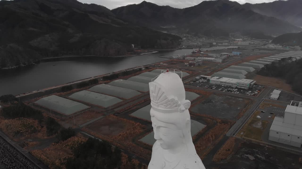 Aerial Drone Fly Above Aizu Jibo Daikannon Statue, Japan Towering Kannon Over Mountain Valley