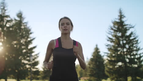 Woman-runner-training-in-park.-Sport-woman-running-in-slow-motion