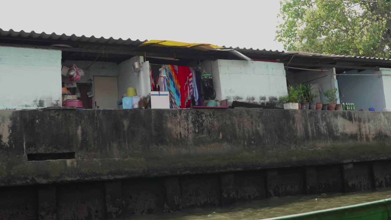 Backside of Poor Local Homes by the Canal in Bangkok. Slow Motion.