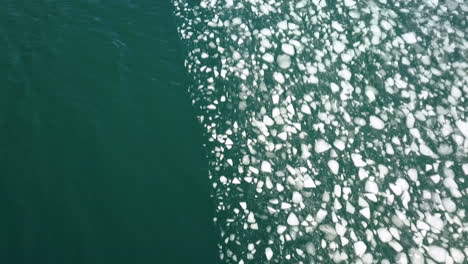 cinematic downward angle drone shot of sea ice near the selfoss area in iceland