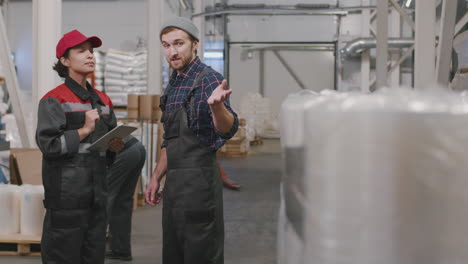 workers talking at polyethylene production plant