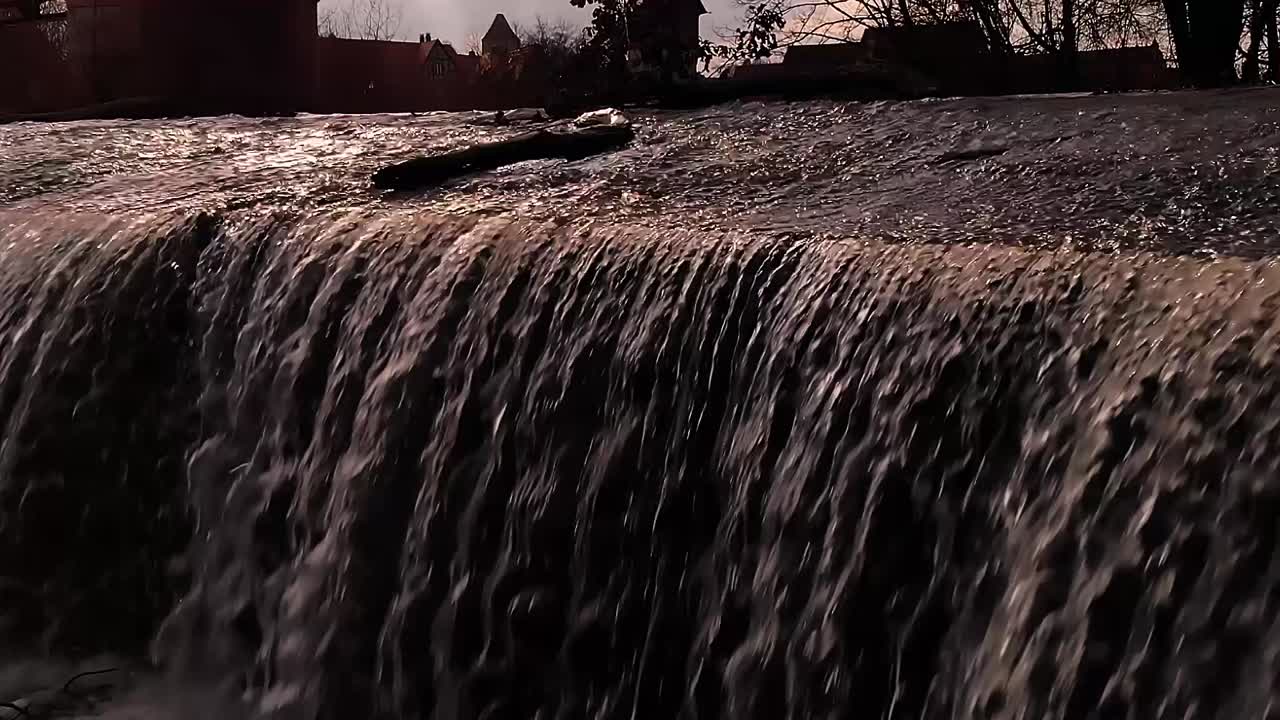 Serene Waterfall in a Historic Town