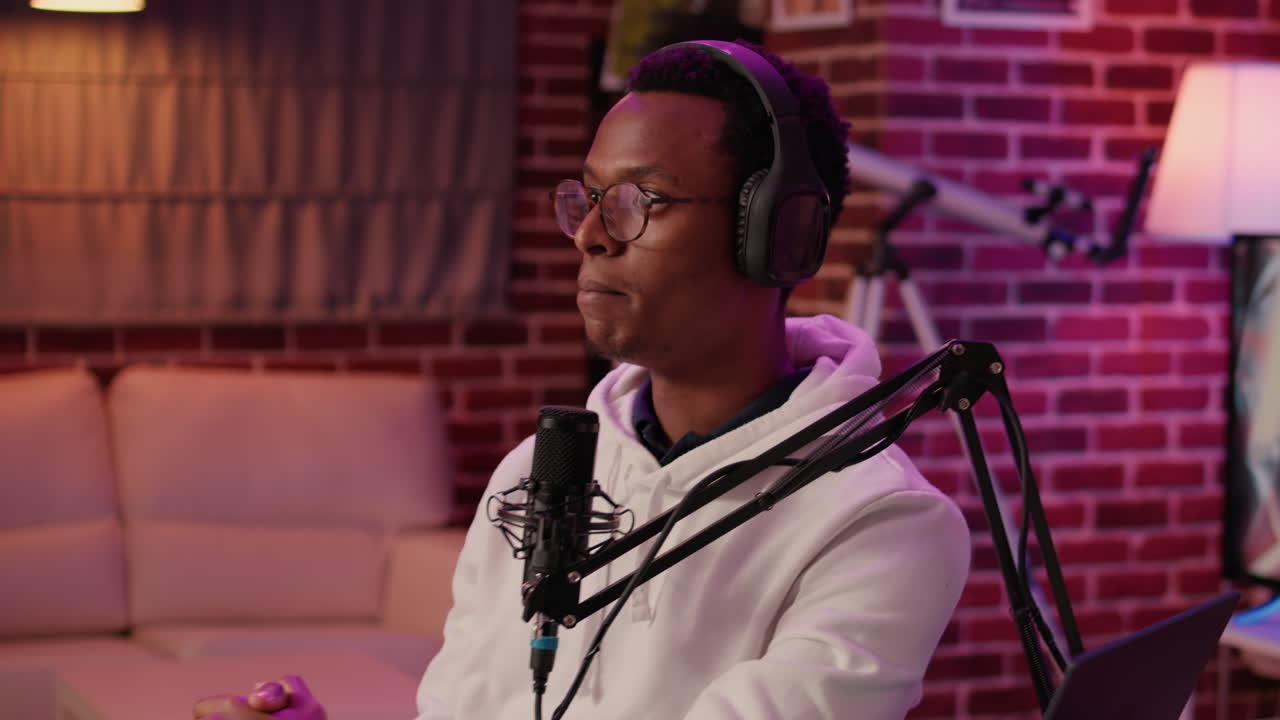 African american host talking in online podcast episode recording live show for social media channel