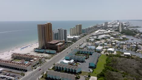 gulf shores, alabama skyline and beach with drone video moving in