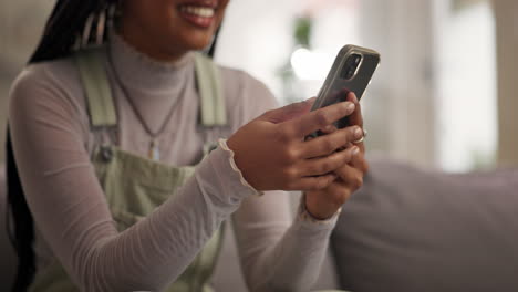 woman using her smartphone at home