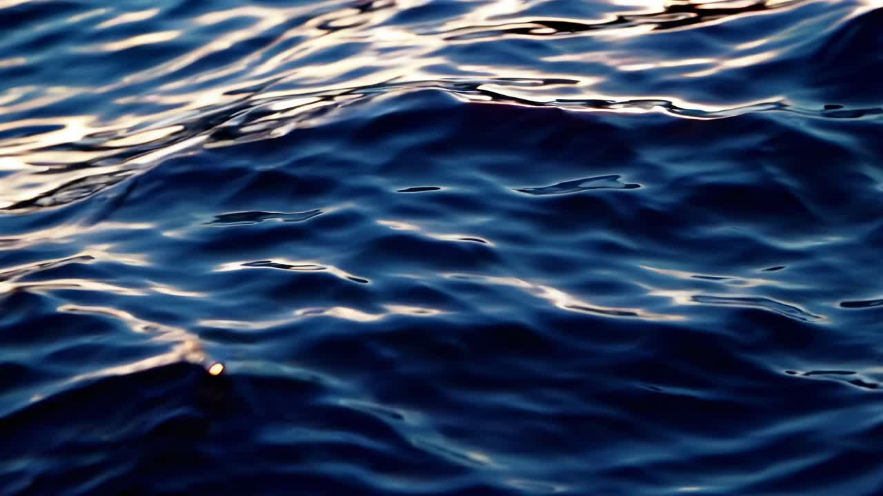 A serene video of rippling water captured from a high-angle view, showcasing the calming movement