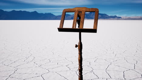 an-old-music-stand-is-on-white-salt-desert