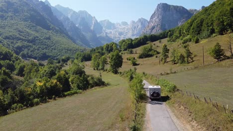 motorhome driving in prokletije national park, montenegro - drone aerial dolly