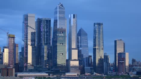 manhattan skyline with empire state building reflecting setting sunlight, dusk travel destination, 4k video