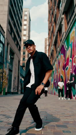 dynamic street dance performance in an urban alley with graffiti