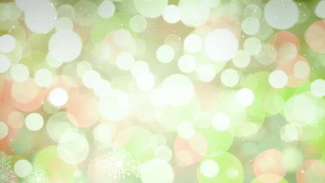 nieve cayendo con círculos de navidad de luz bokeh