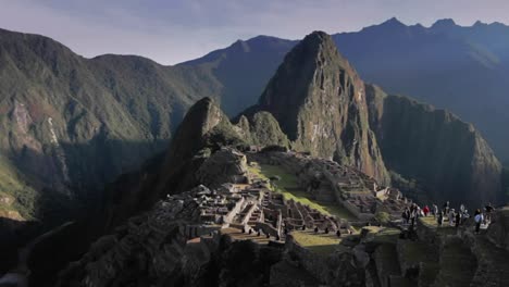 tourist at machu picchu in morning sun