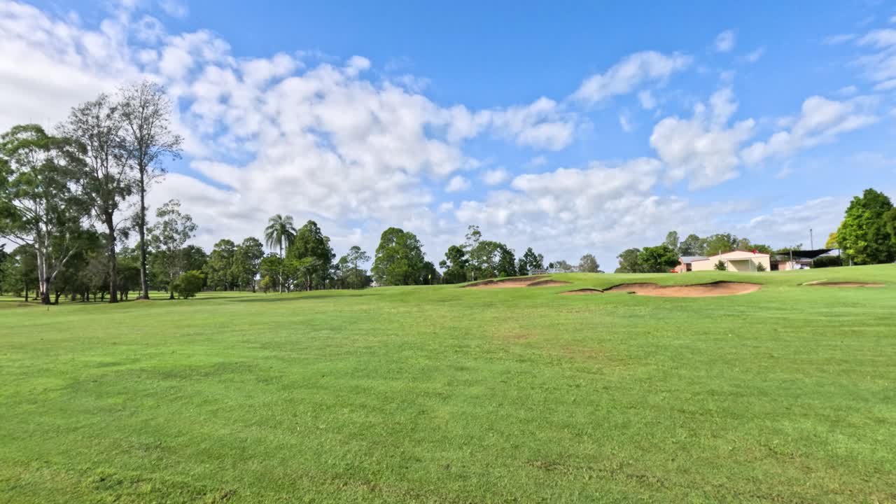 A panoramic view of a golf course over time