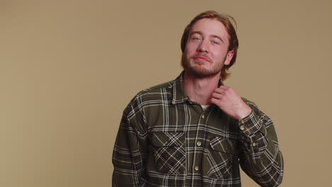 Cheerful-lovely-bearded-adult-man-fashion-model-in-shirt-smiling-and-looking-at-camera-alone