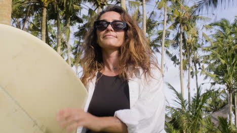 Woman-posing-with-surfboard