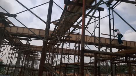 People-constructing-building-framework-using-wooden-formwork