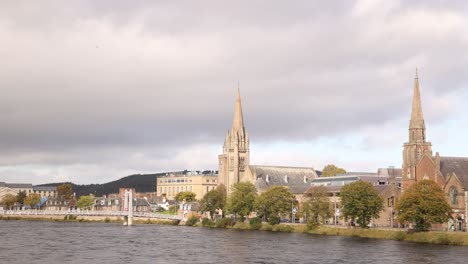 church steeples along the rushing river ness in inverness, scotland in the highlands