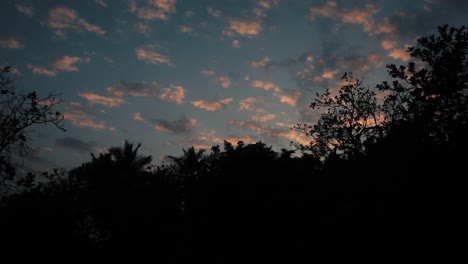 White-clouds-with-pink-sun-light-in-the-sky,-slow-push-in