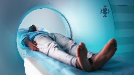 man undergoing mri scan