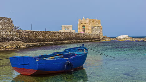 static view of historical ligny tower, old watchtower in trapani, capital city of trapani region on sicily island, italy at daytime in timelapse