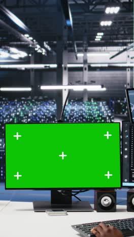 vertical video data center software developer managing ai systems using green screen pc