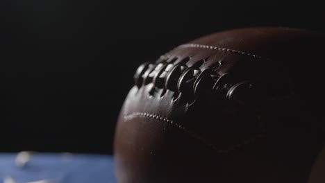 close up studio shot of american football on stars and stripes flag 8