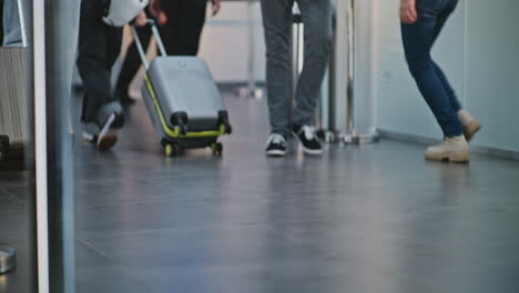 airport terminal with passengers and wheelchair