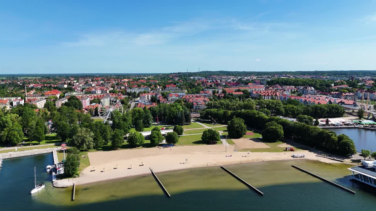 Sandy beach and skyline of Gizycko, aerial drone view