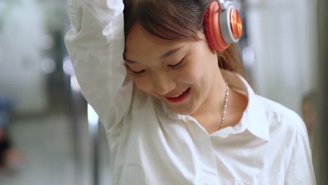 young woman using mobile phone on public train