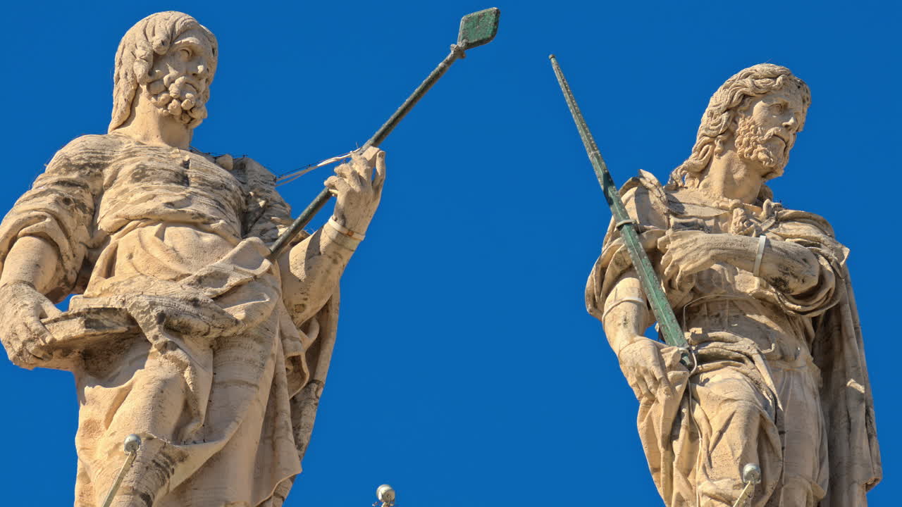 Statues on the Facade of St. Peter's Basilica on the blue sky background, in St. Peter's Square, Vatican City, Rome, Italy