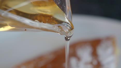 honey pouring over honeycomb