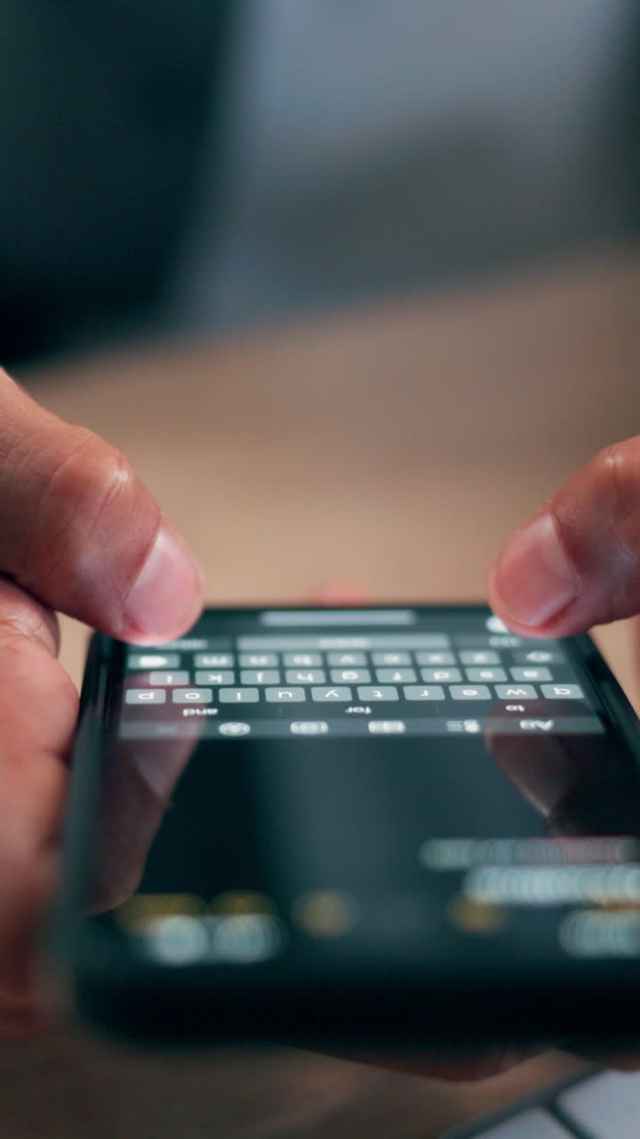 Close-up of Hands Typing on a Smartphone Screen