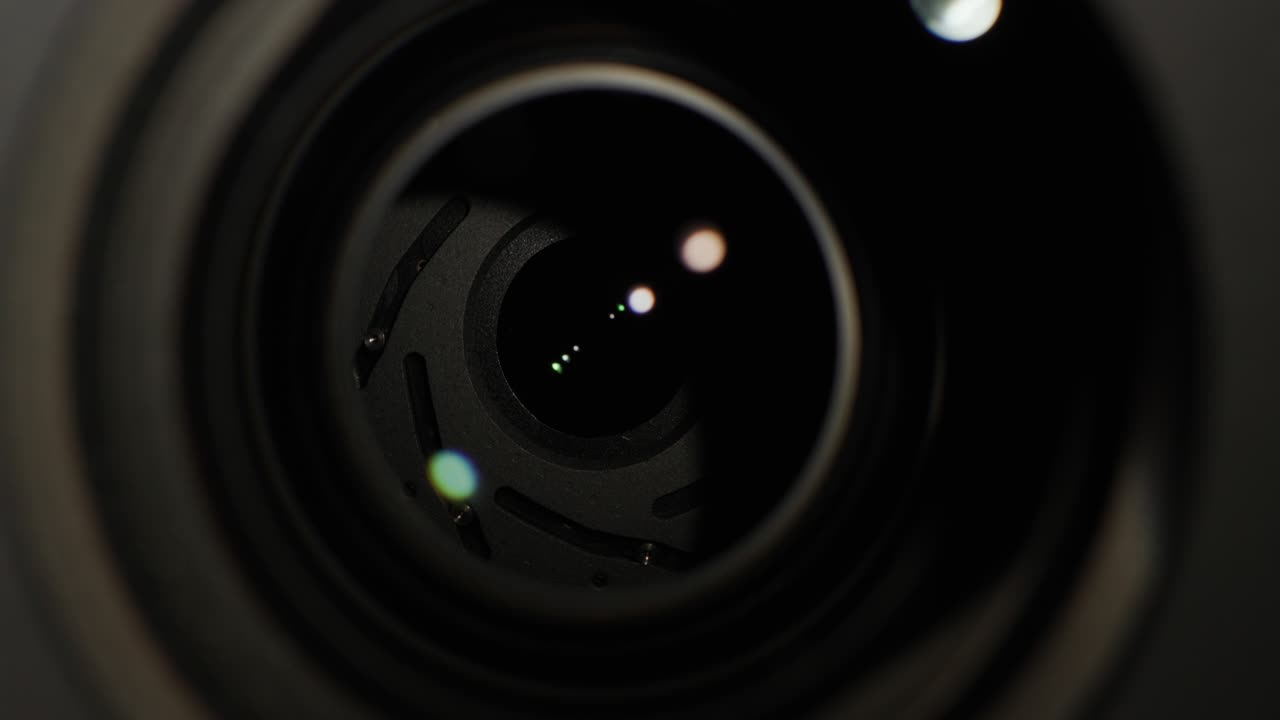 Light illuminates the lens of the kumera, glare and reflections illuminate the glass