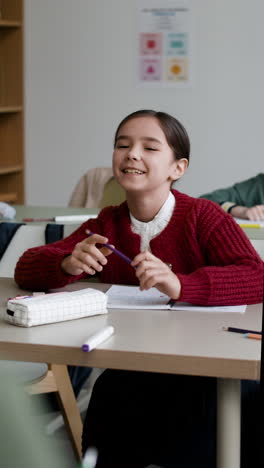 happy schoolgirl in classroom