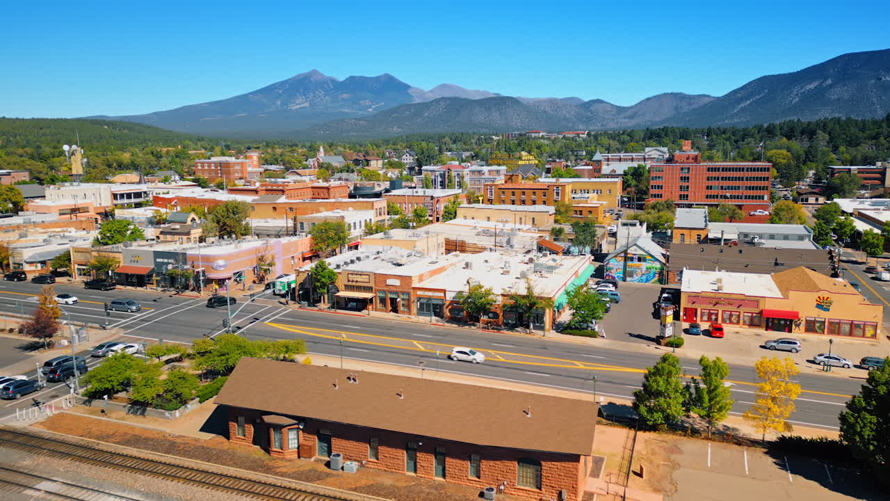 Flagstaff, USA, 24 August 2025: Beautiful cozy green city surrounded by mountains. Drone footage over Flagstaff, Arizona, USA on sunny day