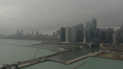 chicago, il with fog and light snow drone pulling back