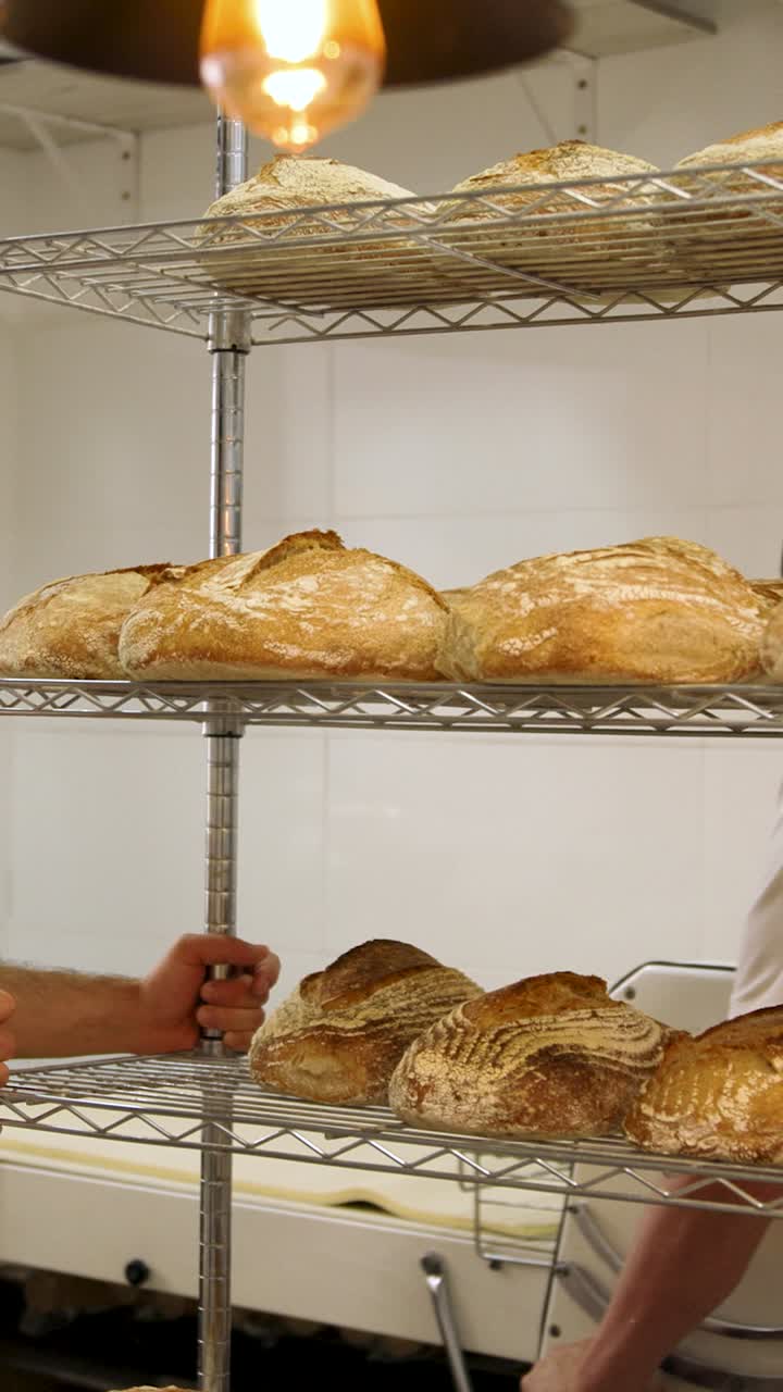 Freshly Baked Artisan Bread Loaves on a Rack in a Bakery