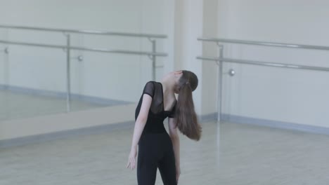 young ballet girl at studio lesson. training performance. stretching exercise pose. ballerina practice balance technique. classical elegance fitness.