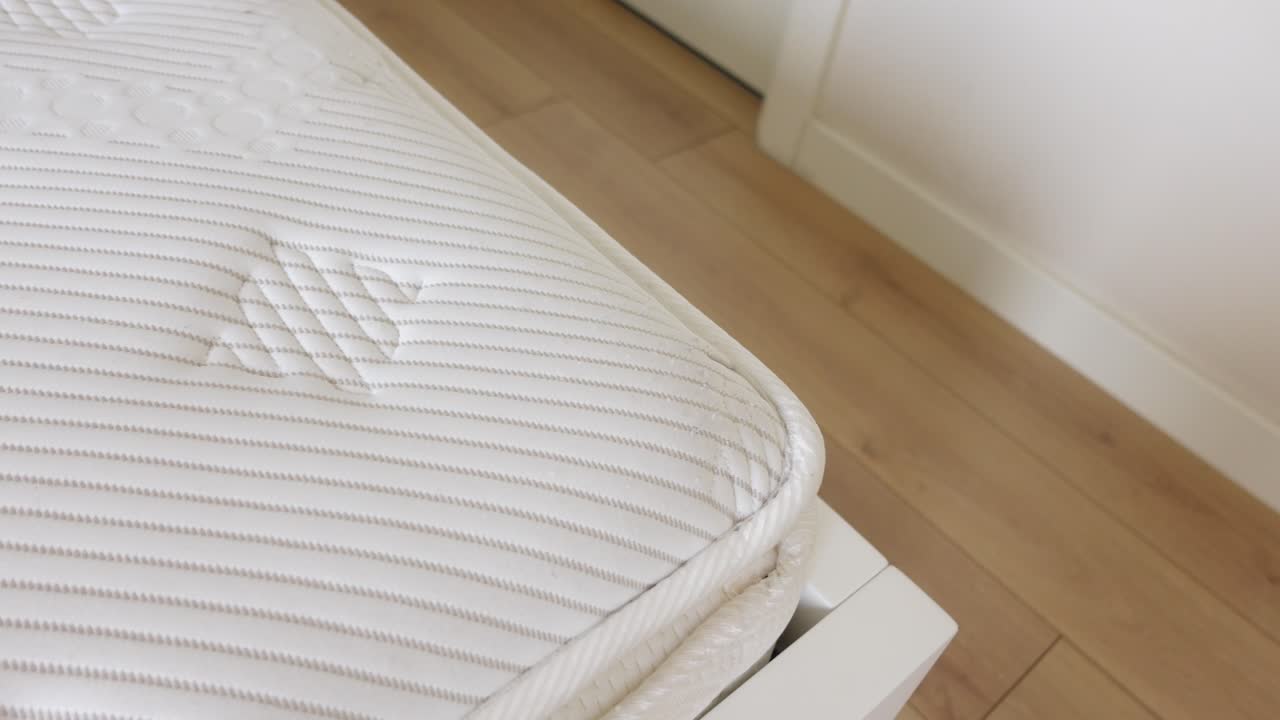 Close-up view of a white mattress corner