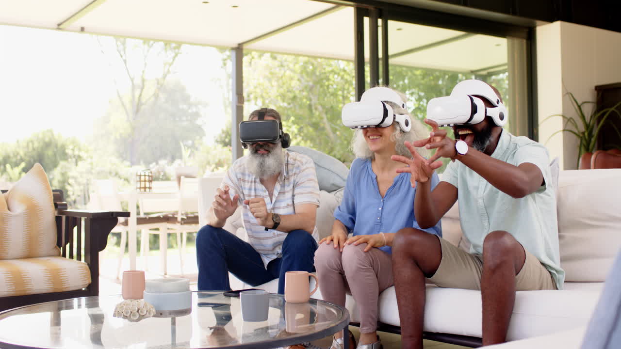 Using VR headsets, senior friends enjoying virtual reality experience together